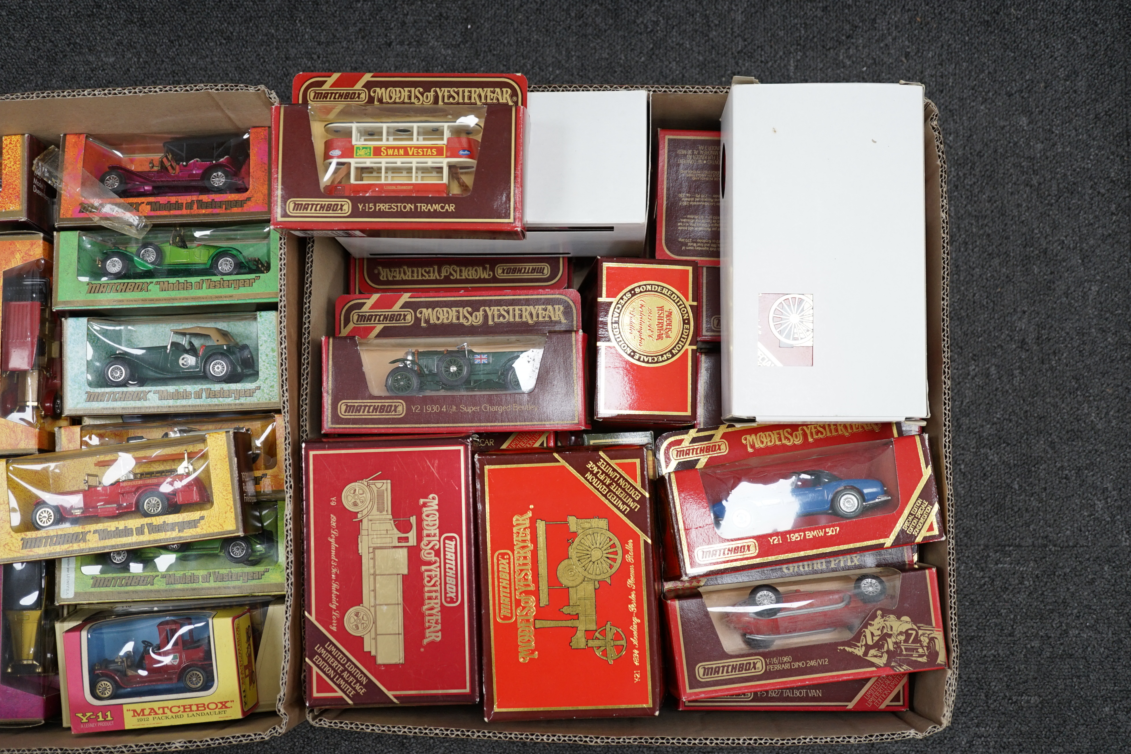 Seventy-nine Matchbox Models of Yesteryear in mainly woodgrain, cream and maroon era boxes, including cars and commercial vehicles
